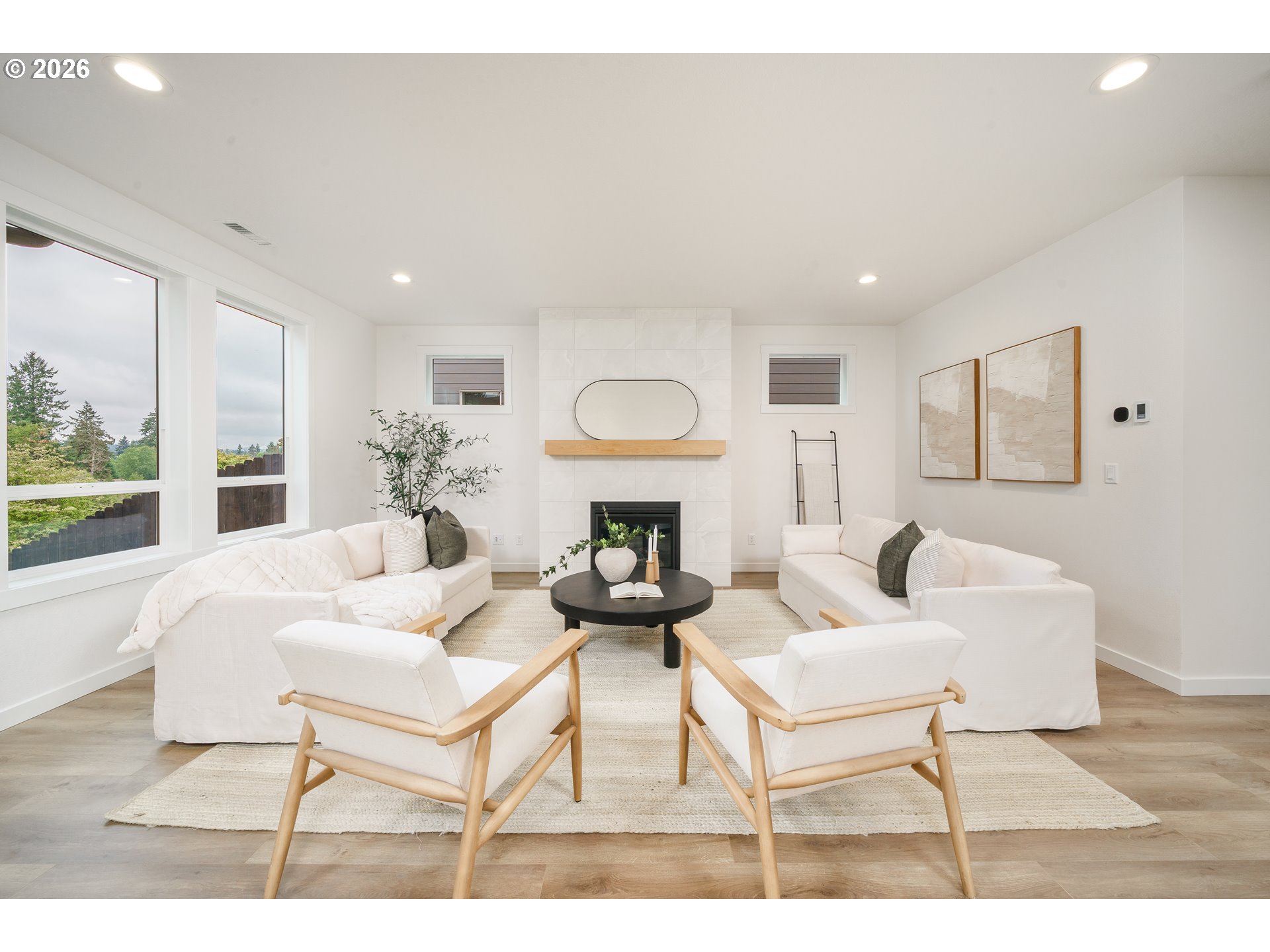 1908 Northwest 21st Circle Battle Ground, WA 98604 - Photo 36 of 40 a living room with furniture a fireplace and a large window