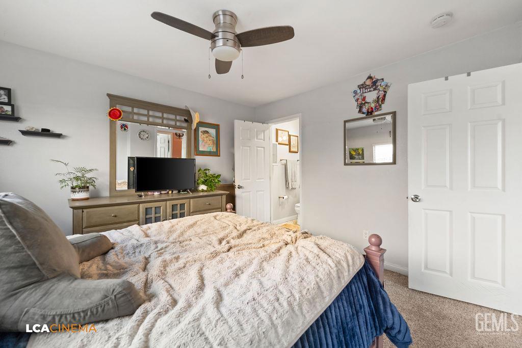 Undisclosed Address Wasco, CA 93280 - Photo 11 of 26 a bedroom with a bed and a flat screen tv