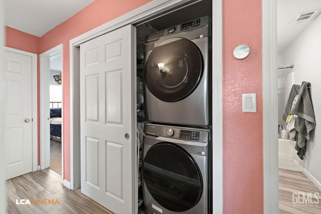 Undisclosed Address Wasco, CA 93280 - Photo 13 of 26 a view of a hallway with washer and dryer
