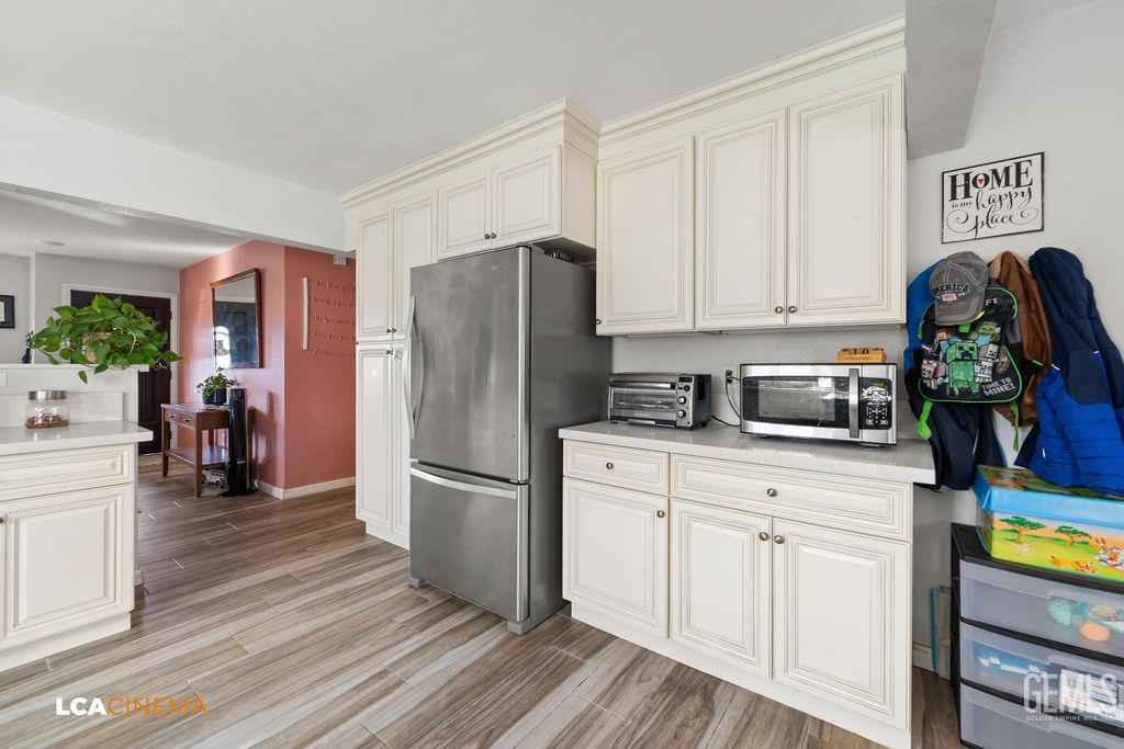 Undisclosed Address Wasco, CA 93280 - Photo 7 of 26 a kitchen with stainless steel appliances granite countertop a refrigerator and a stove top oven