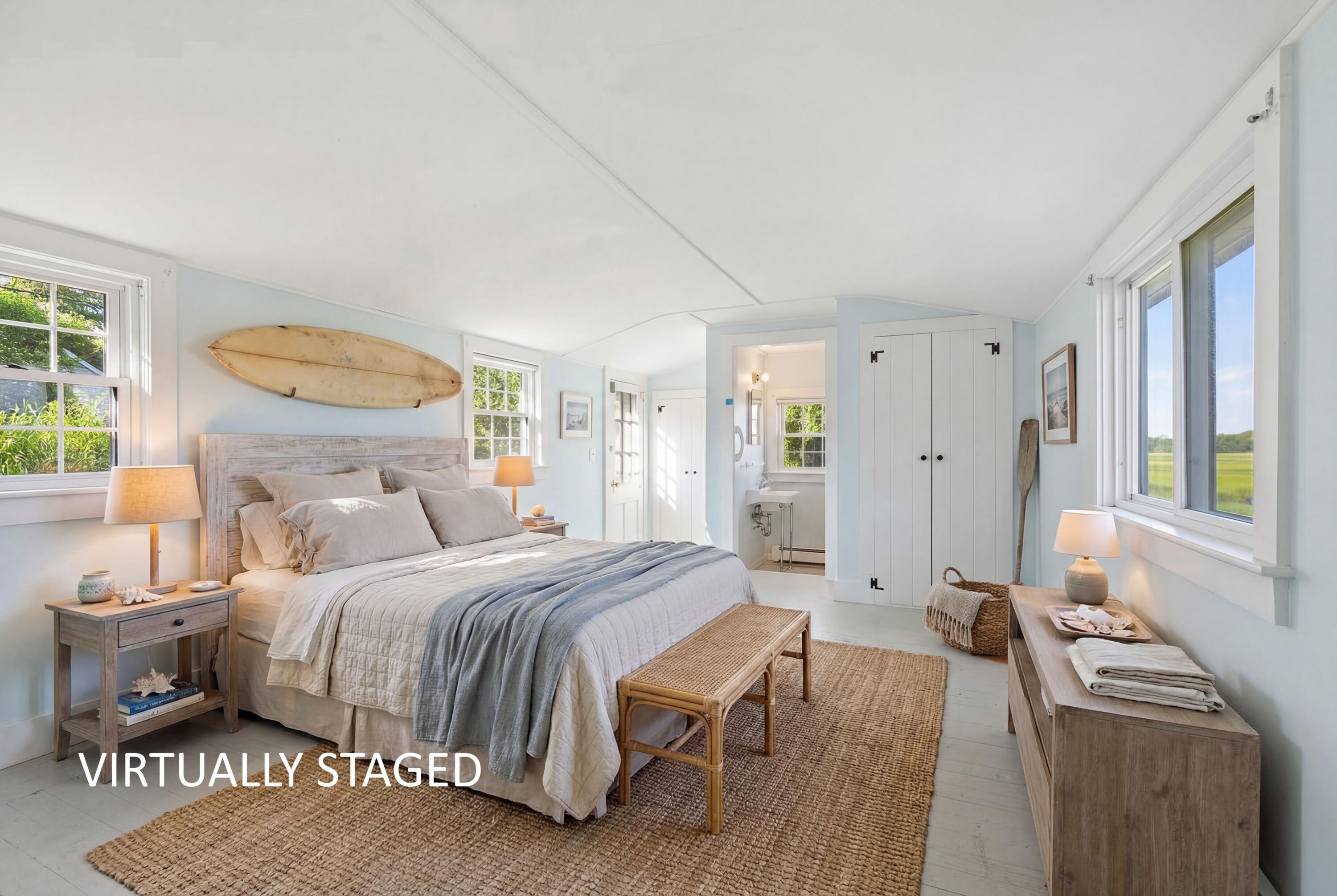 181 Rock Harbor Road Orleans, MA 02653 - Photo 13 of 16 a bedroom with a bed and a cabinets