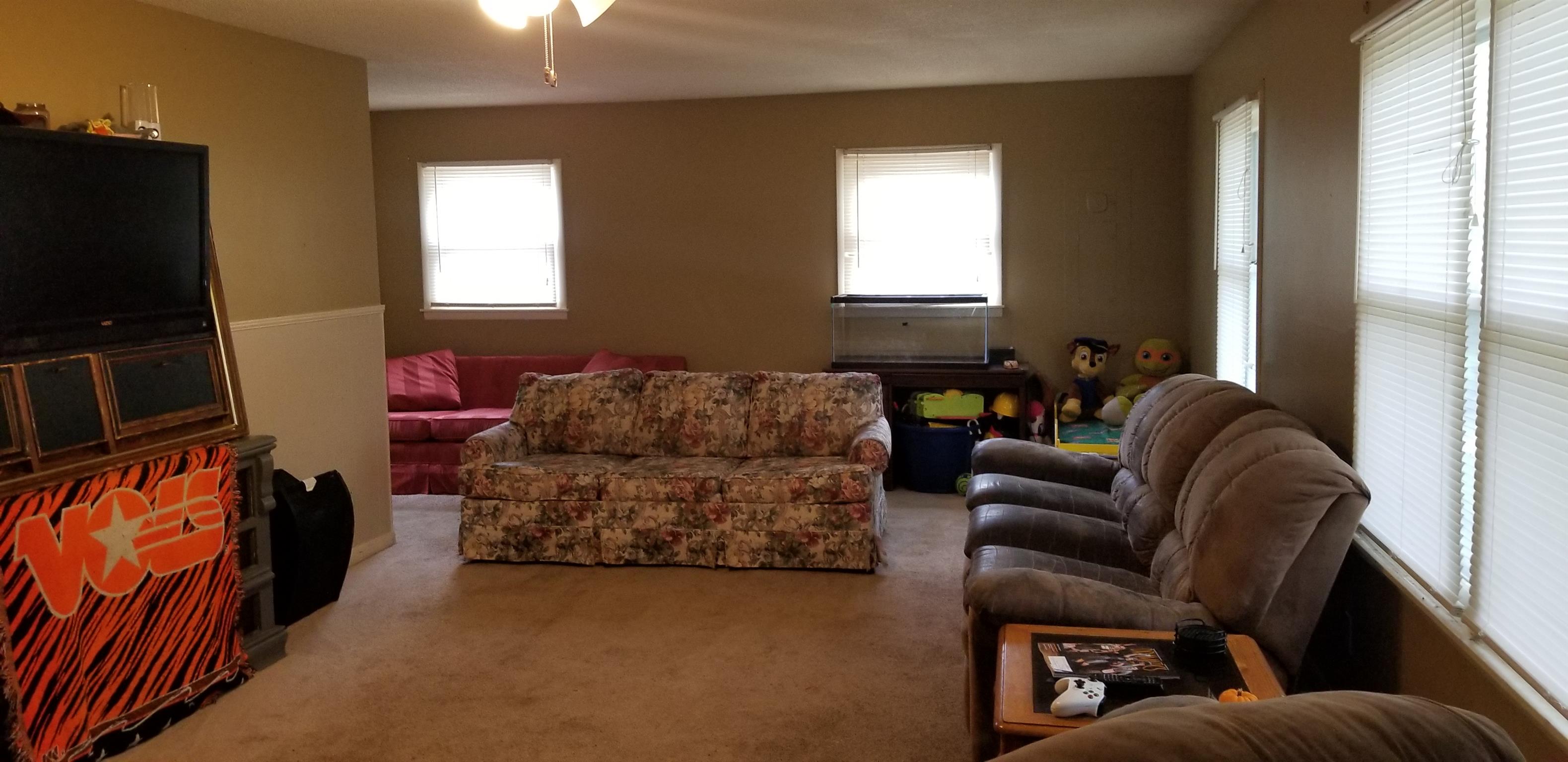 157 West Riddle Road Manchester, TN 37355 - Photo 1 of 17 Spacious living room. Dining area in back currently used for additional seating.