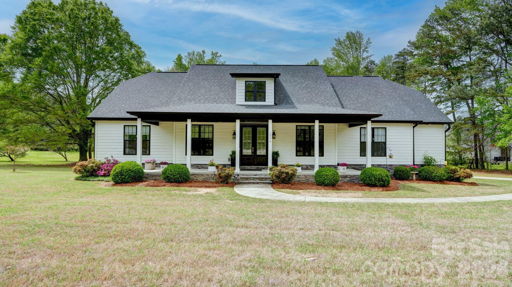 1775 Enochville Road Kannapolis, NC 28081 - Photo 1 of 41 a front view of a house with yard and green space