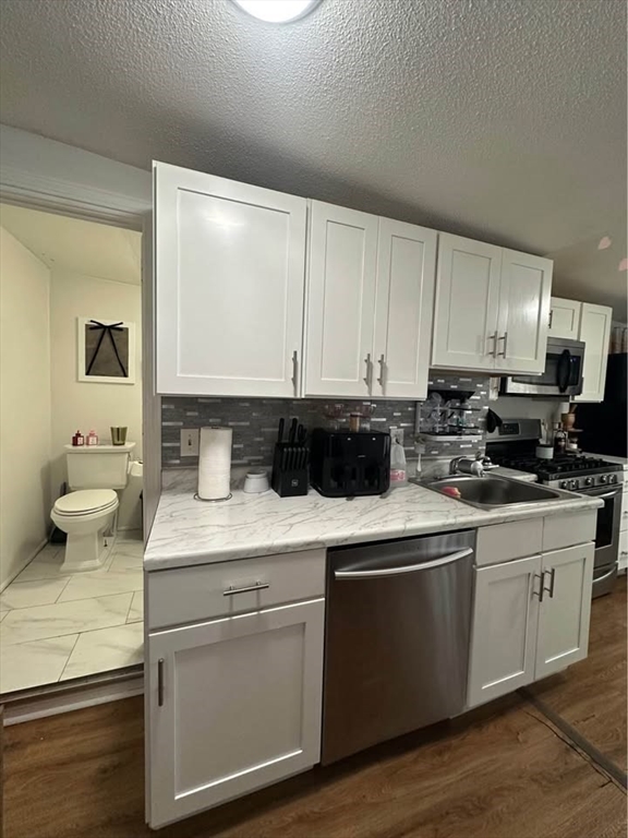 2 Prospect Street, Unit 2 Haverhill, MA 01832 - Photo 2 of 14 a kitchen with a sink and cabinets