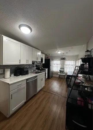 a kitchen with lots of counter top space and a sink