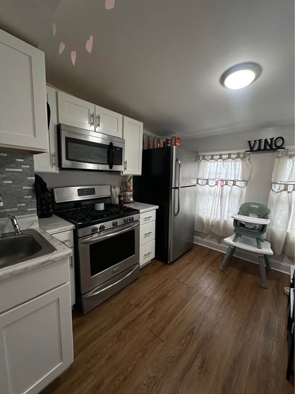 2 Prospect Street, Unit 2 Haverhill, MA 01832 - Photo 10 of 14 a kitchen with granite countertop a stove and a refrigerator