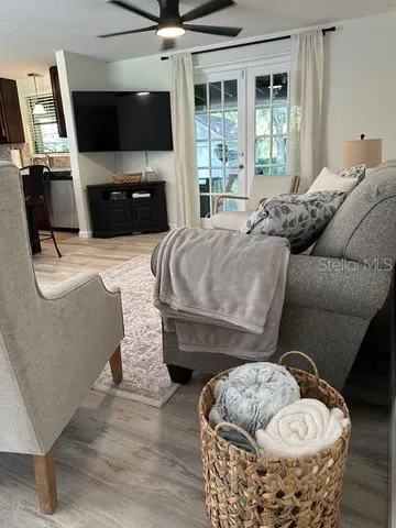 a living room with furniture and a flat screen tv