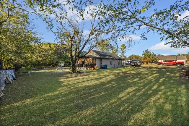 a view of a house with a big yard