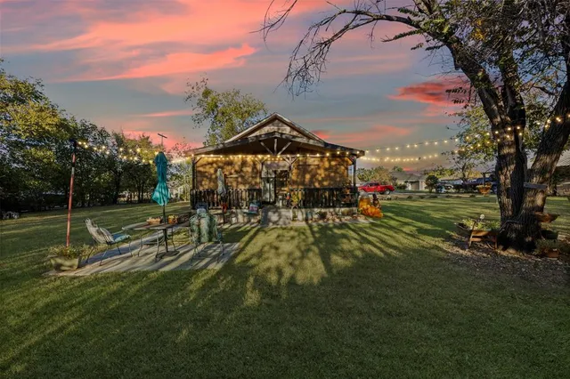 a view of a park with large trees