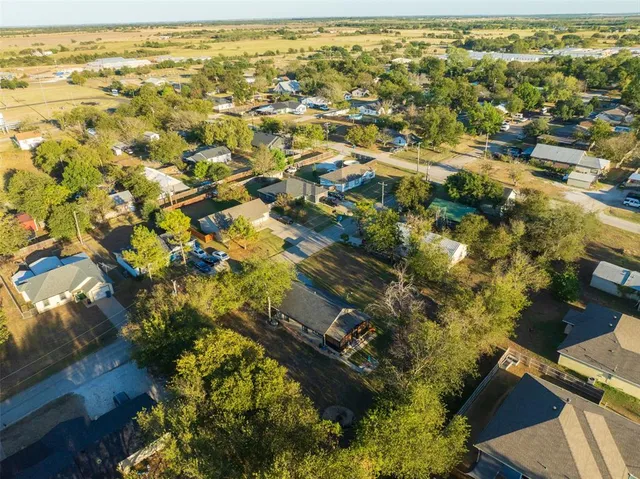 an aerial view of residential houses with outdoor space