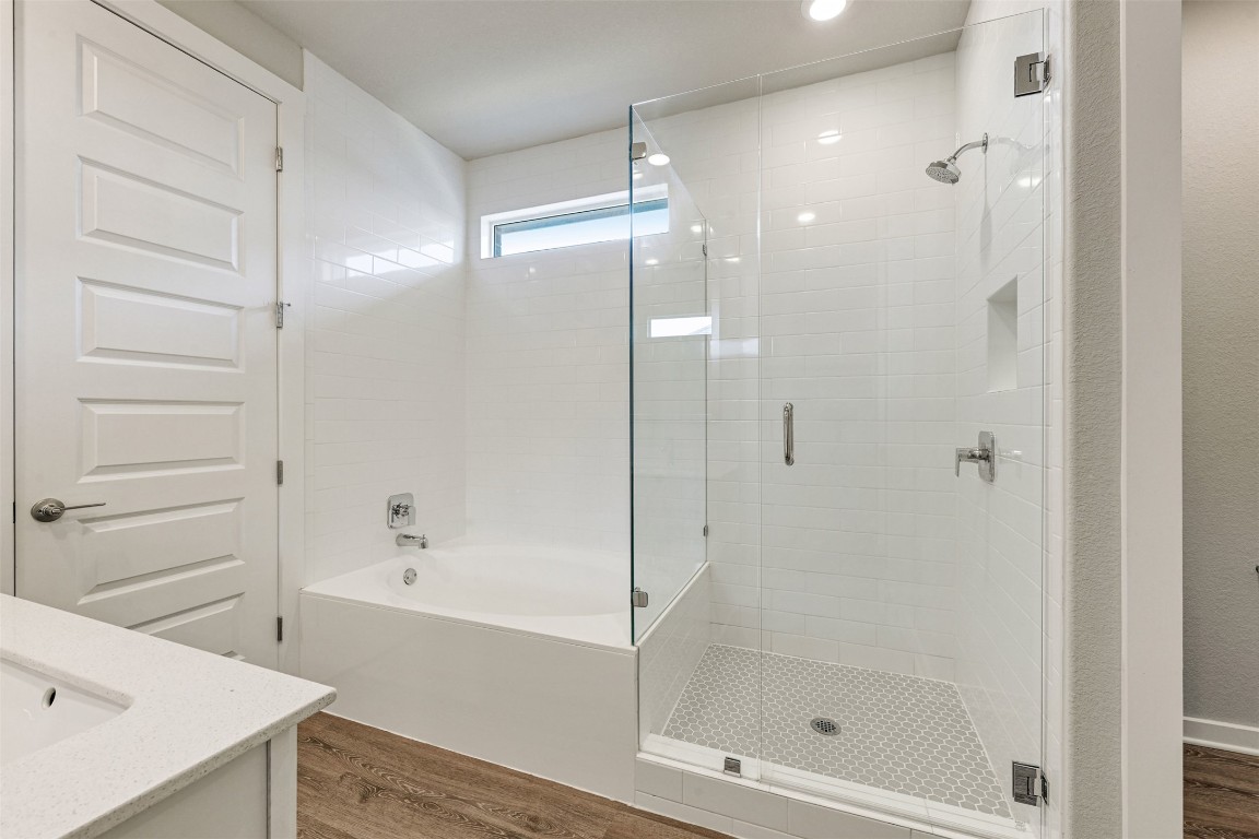 2016 Bobtail Pass Leander, TX 78641 - Photo 20 of 40 a bathroom with a shower and a bath tub