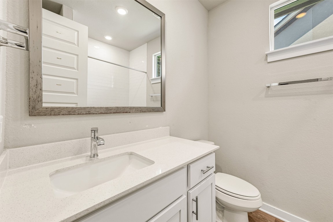 2016 Bobtail Pass Leander, TX 78641 - Photo 28 of 40 a bathroom with a sink toilet and mirror