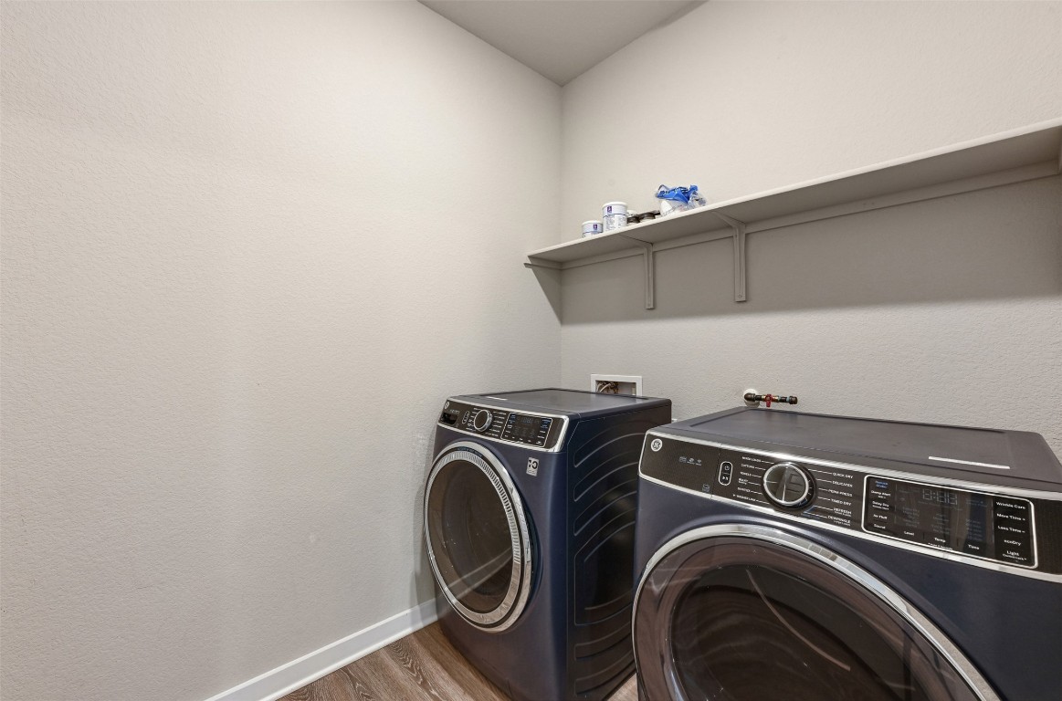 2016 Bobtail Pass Leander, TX 78641 - Photo 30 of 40 a utility room with dryer and washer