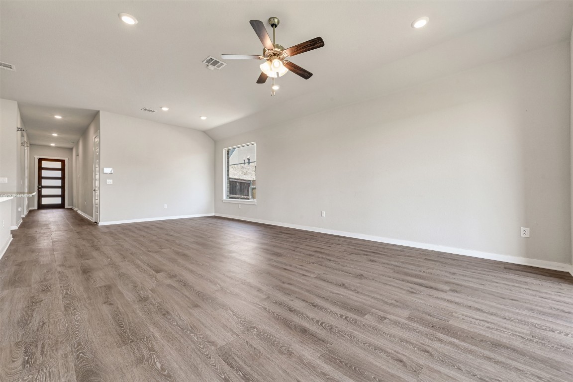 2016 Bobtail Pass Leander, TX 78641 - Photo 5 of 40 an empty room with wooden floor and ceiling fan