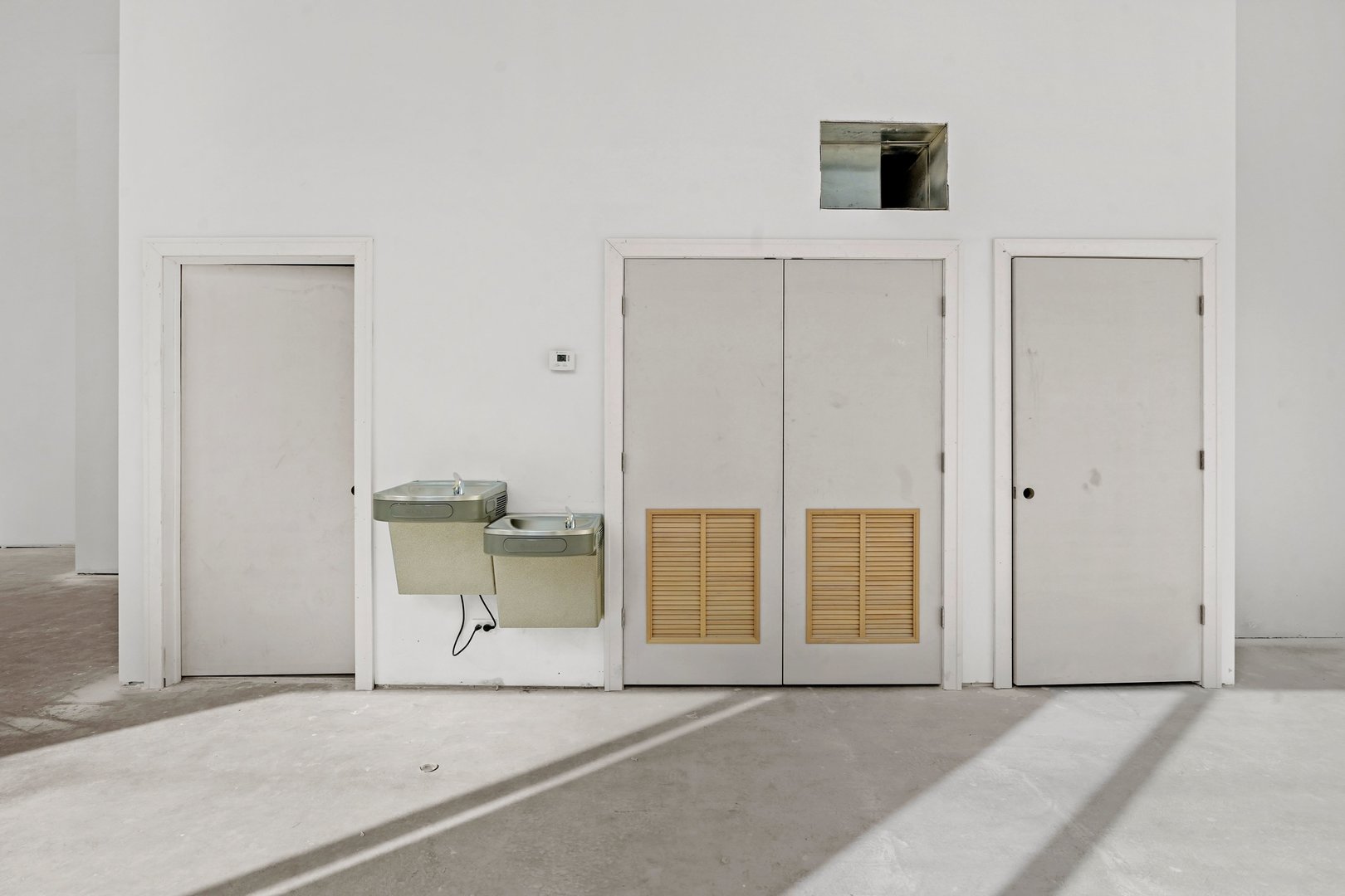 816 West Cullerton Street, Unit 1W Chicago, IL 60608 - Photo 17 of 34 a view of empty room with wooden floor and cabinet