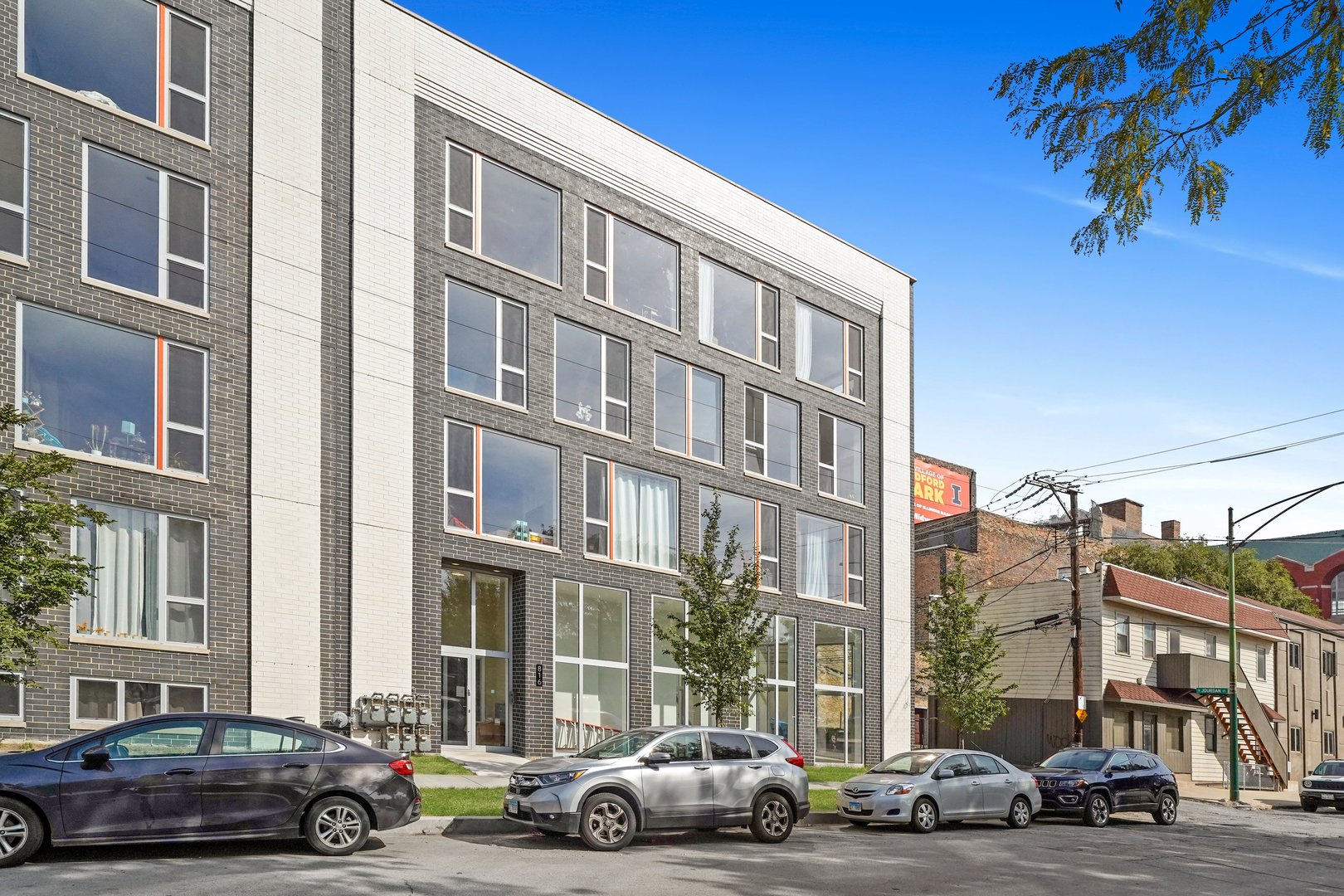 816 West Cullerton Street, Unit 1W Chicago, IL 60608 - Photo 27 of 34 a cars parked in front of a building