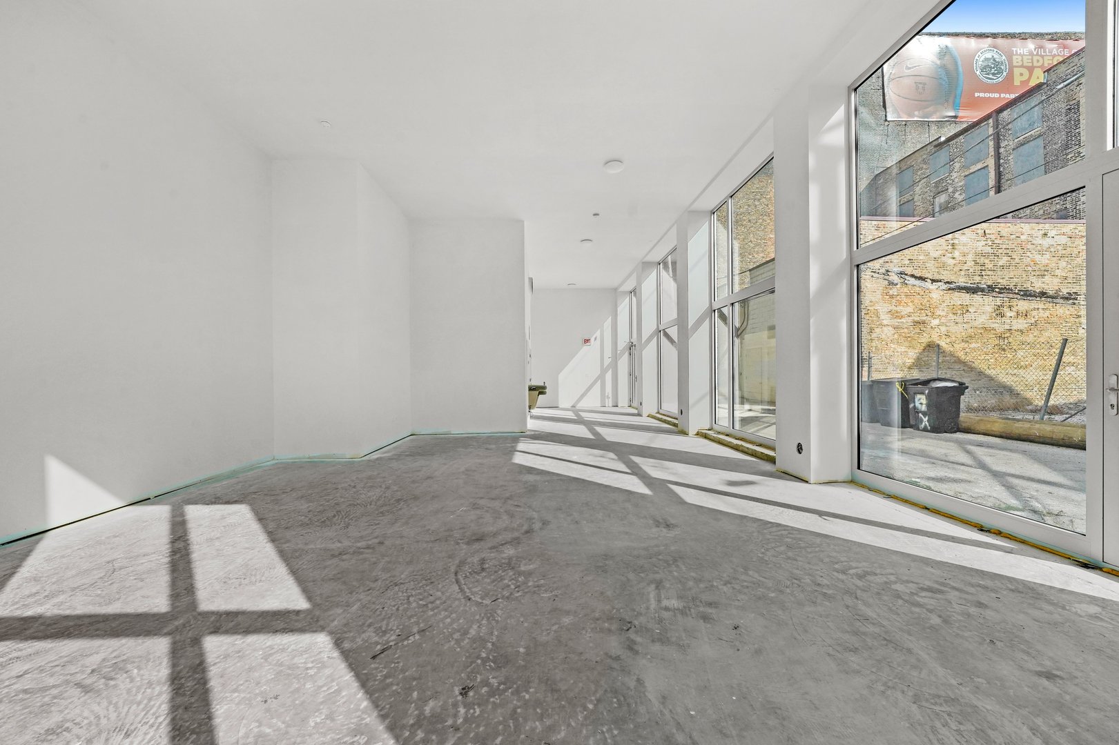 816 West Cullerton Street, Unit 1W Chicago, IL 60608 - Photo 10 of 34 a view of a room with wooden floor and windows