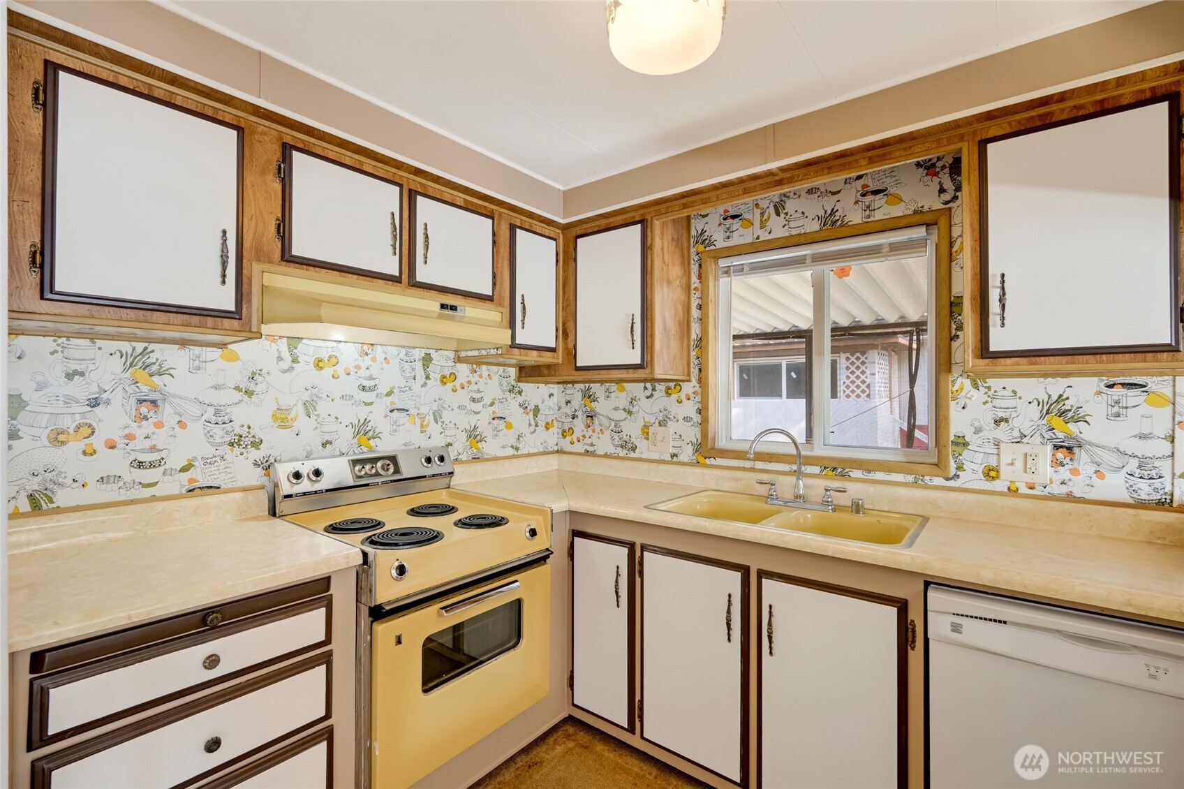 920 Maple Street, Unit 18 Sedro-Woolley, WA 98284 - Photo 14 of 32 a view of a kitchen with a sink and a stove top oven