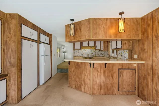 a kitchen with a refrigerator and countertop