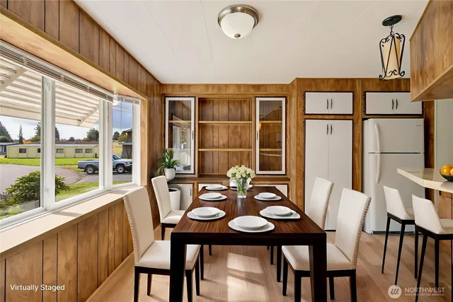 a view of a dining room with furniture window and outside view