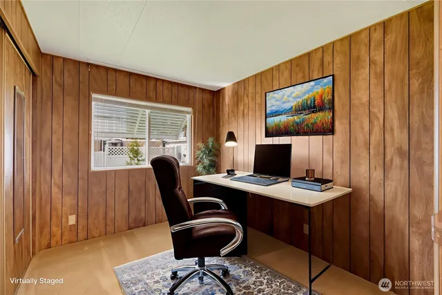 a view of an empty room with wooden walls