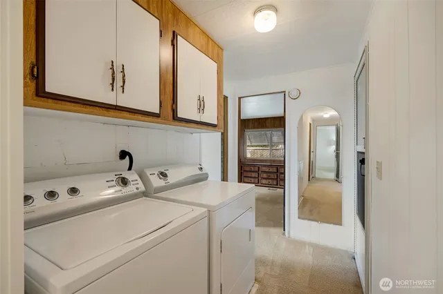 a bathroom with a granite countertop sink mirror and a bathtub