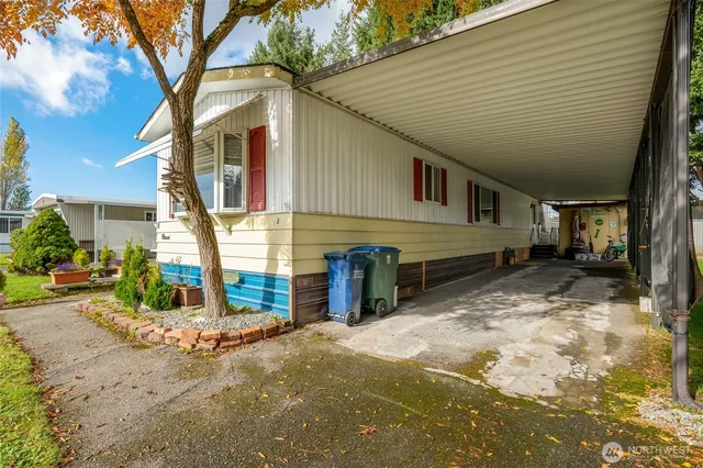 a front view of a house with outdoor seating