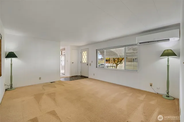 a view of an empty room with a window