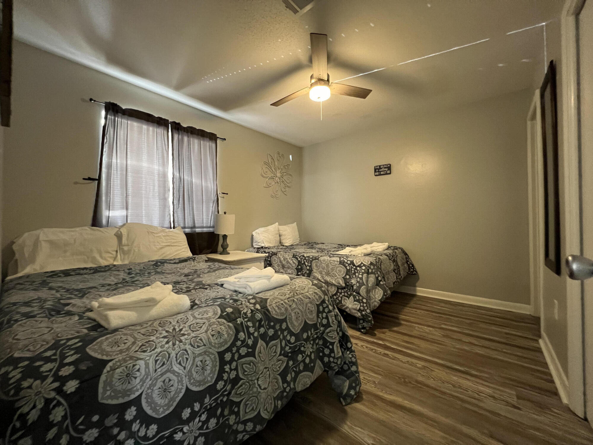 24 Blenheim Lane, Unit 7 Santa Rosa Beach, FL 32459 - Photo 7 of 11 a bedroom with a bed and wooden floor