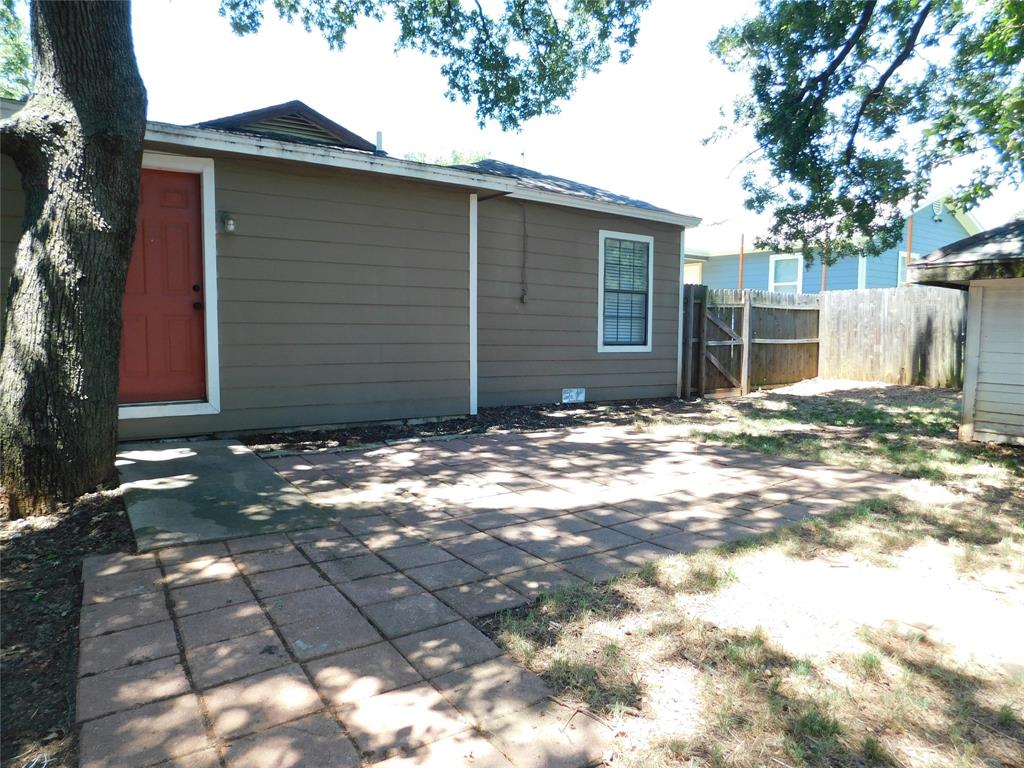 714 North Ruddell Street Denton, TX 76209 - Photo 19 of 20 a view of a house with a yard
