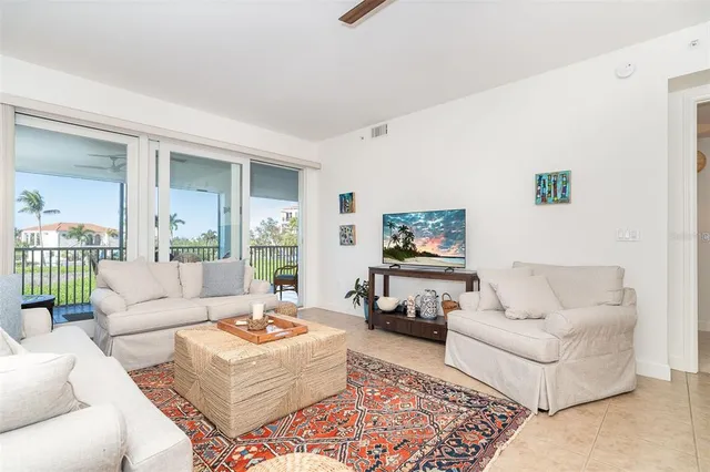a dining room with furniture and entryway