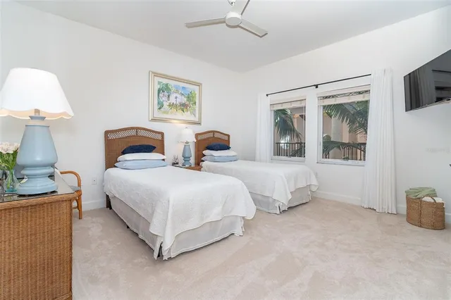 a bathroom with a bathtub shower sink mirror vanity and toilet
