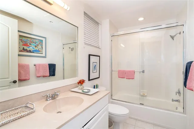 a view of a kitchen with kitchen island a window and stainless steel appliances