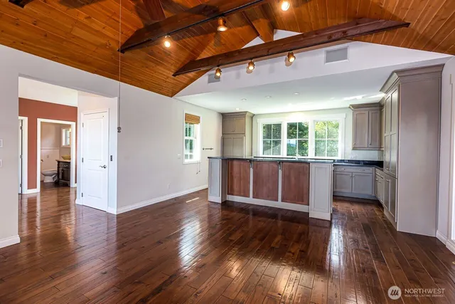 a kitchen with a stove and a refrigerator