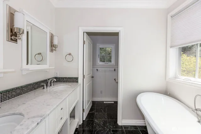 a view of a house with a large window and wooden floor