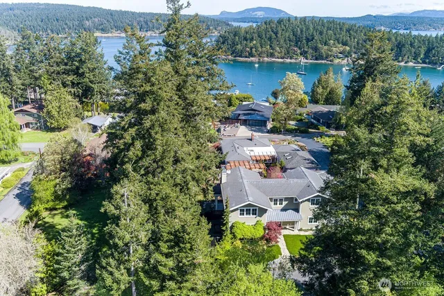an aerial view of house with yard and outdoor seating