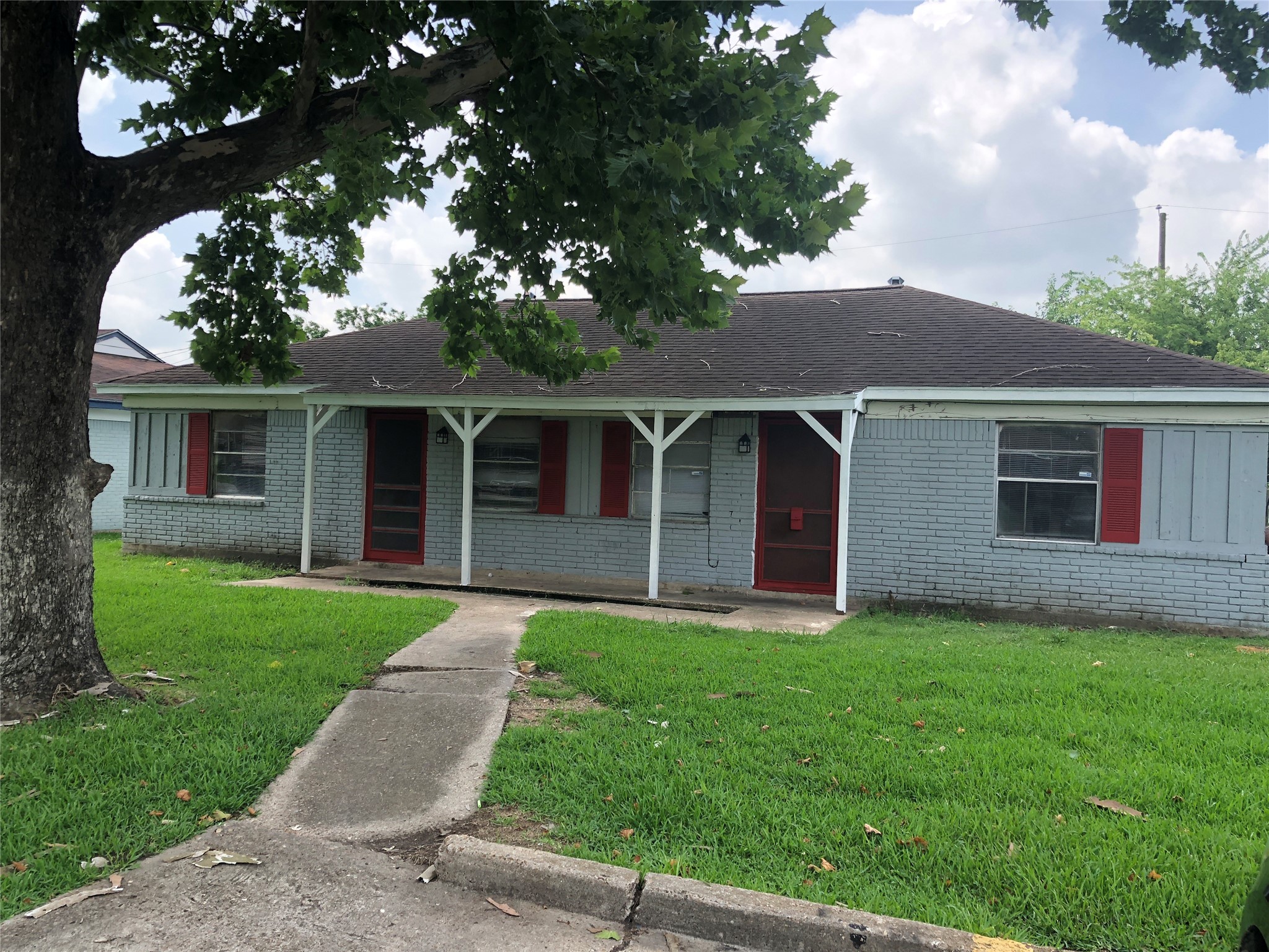 front view of a house with a yard