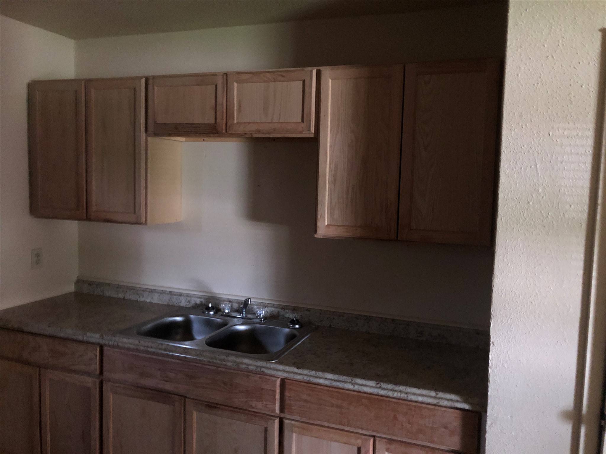 4223 Rockingham Street Houston, TX 77051 - Photo 3 of 7 a kitchen with a sink and cabinets