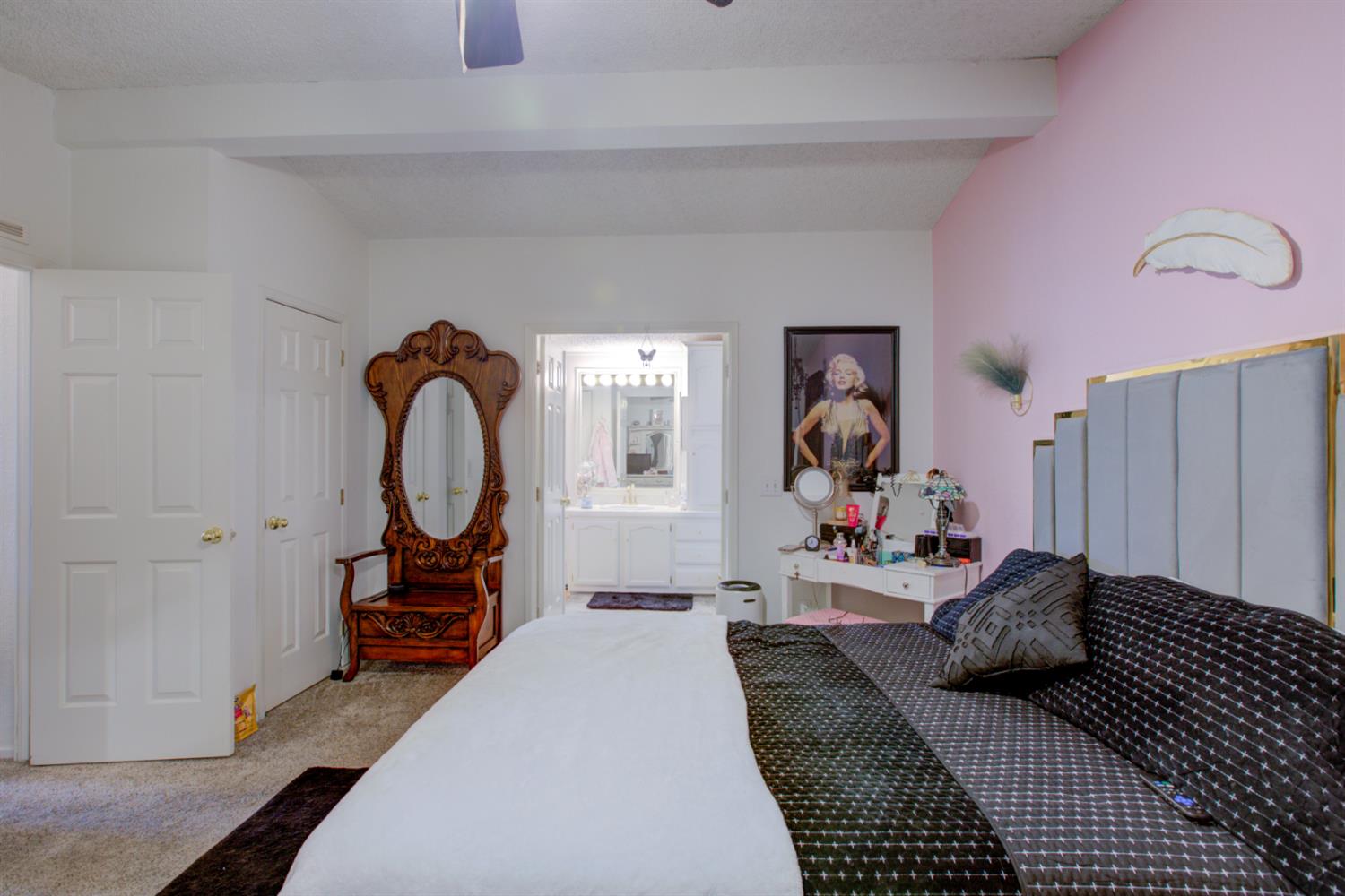 500 North Tully Road, Unit 64 Turlock, CA 95380 - Photo 11 of 38 a bedroom with a bed and a large mirror on the dresser