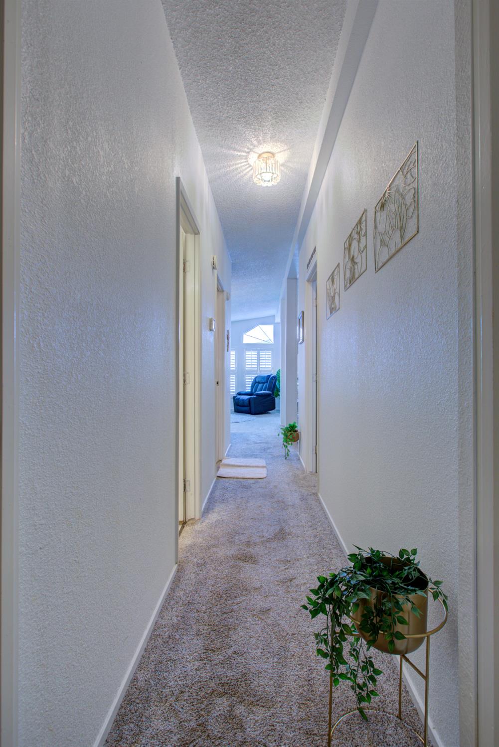 500 North Tully Road, Unit 64 Turlock, CA 95380 - Photo 15 of 38 a view of a hallway to a room