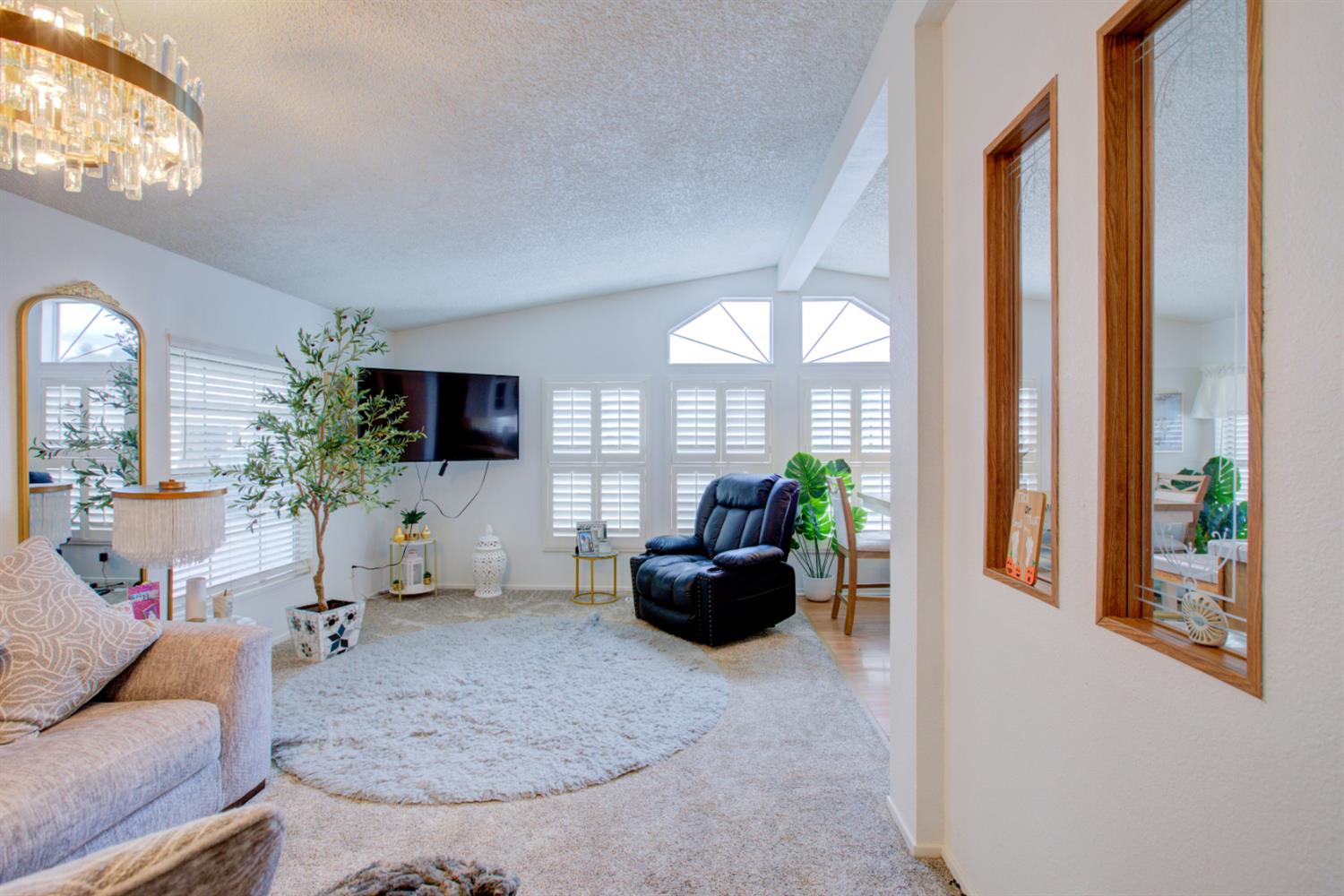 500 North Tully Road, Unit 64 Turlock, CA 95380 - Photo 19 of 38 a living room with furniture and a flat screen tv