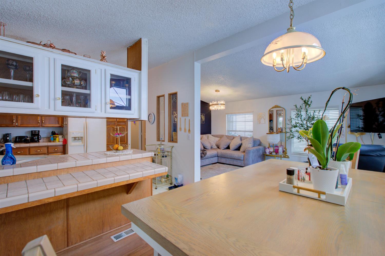 500 North Tully Road, Unit 64 Turlock, CA 95380 - Photo 24 of 38 a swimming pool with a large window and living room view