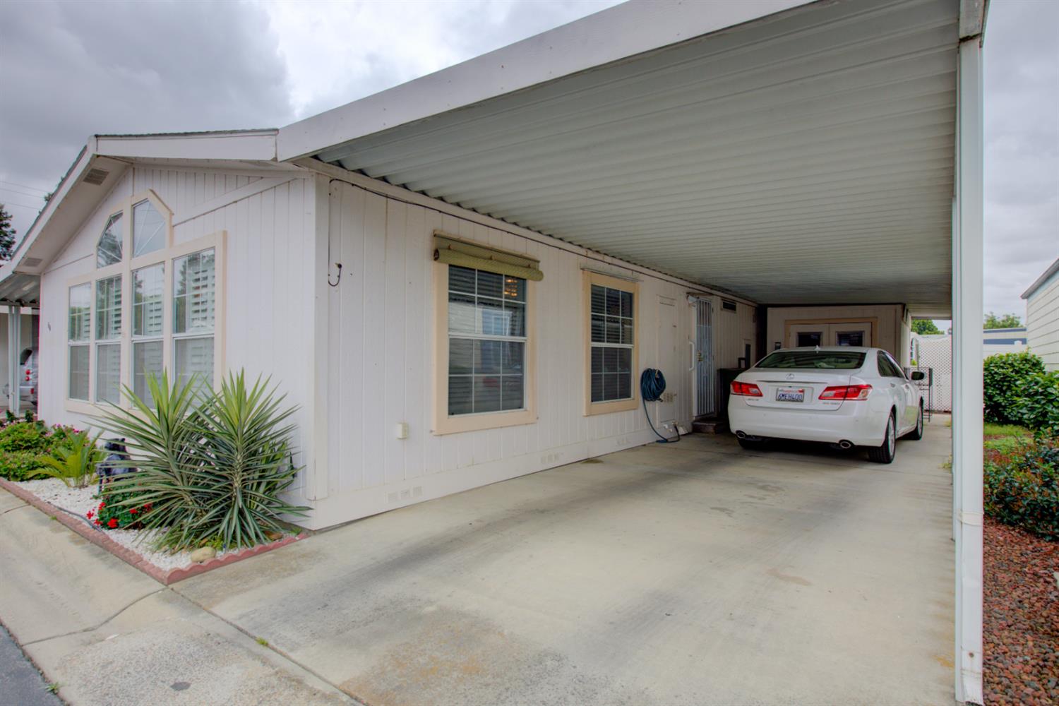 500 North Tully Road, Unit 64 Turlock, CA 95380 - Photo 30 of 38 a car parked in front of house