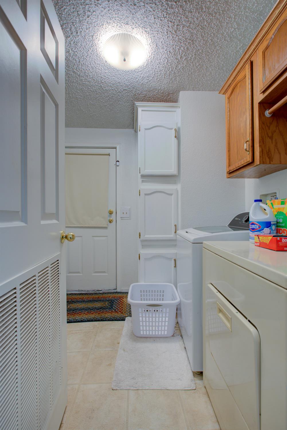 500 North Tully Road, Unit 64 Turlock, CA 95380 - Photo 7 of 38 a storage room with washer and dryer