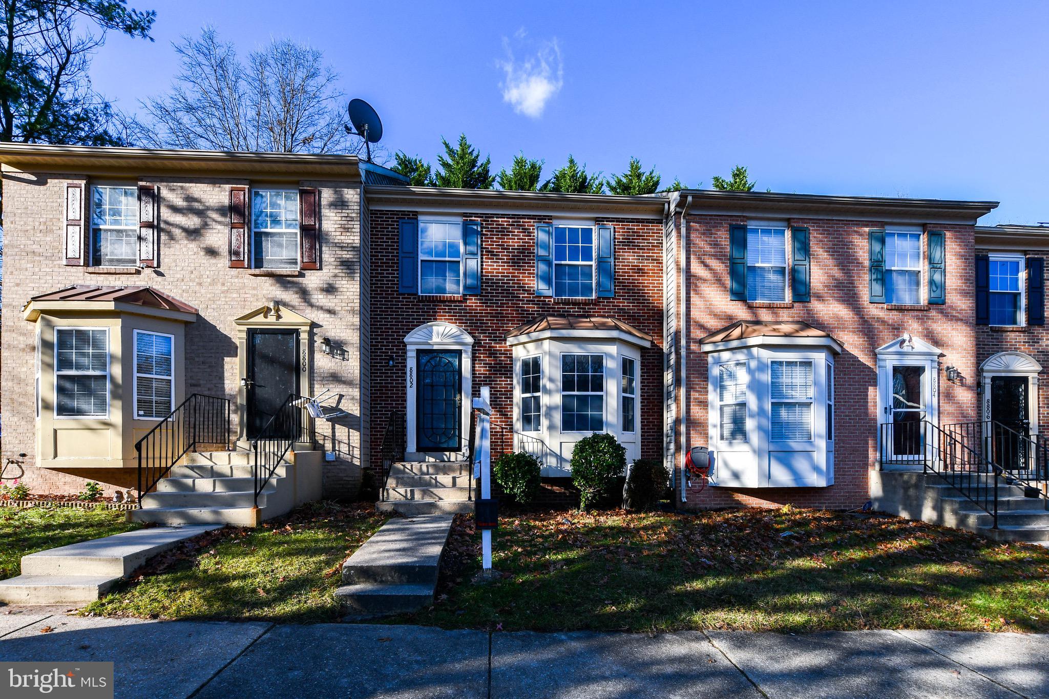 8802 Ritchboro Road District Heights, MD 20747 - Photo 5 of 66 a view of a building with a yard in front and trees