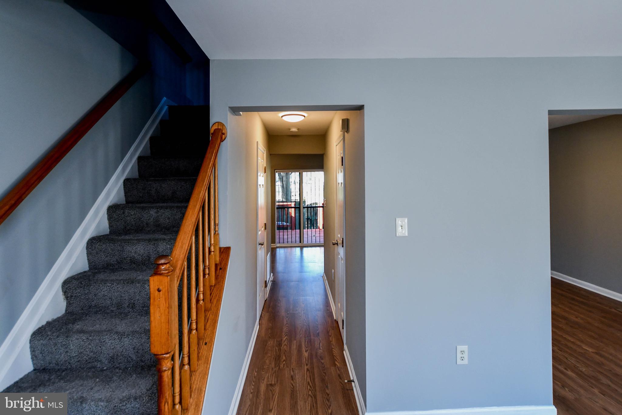 8802 Ritchboro Road District Heights, MD 20747 - Photo 7 of 66 a view of staircase with wooden floor and white walls