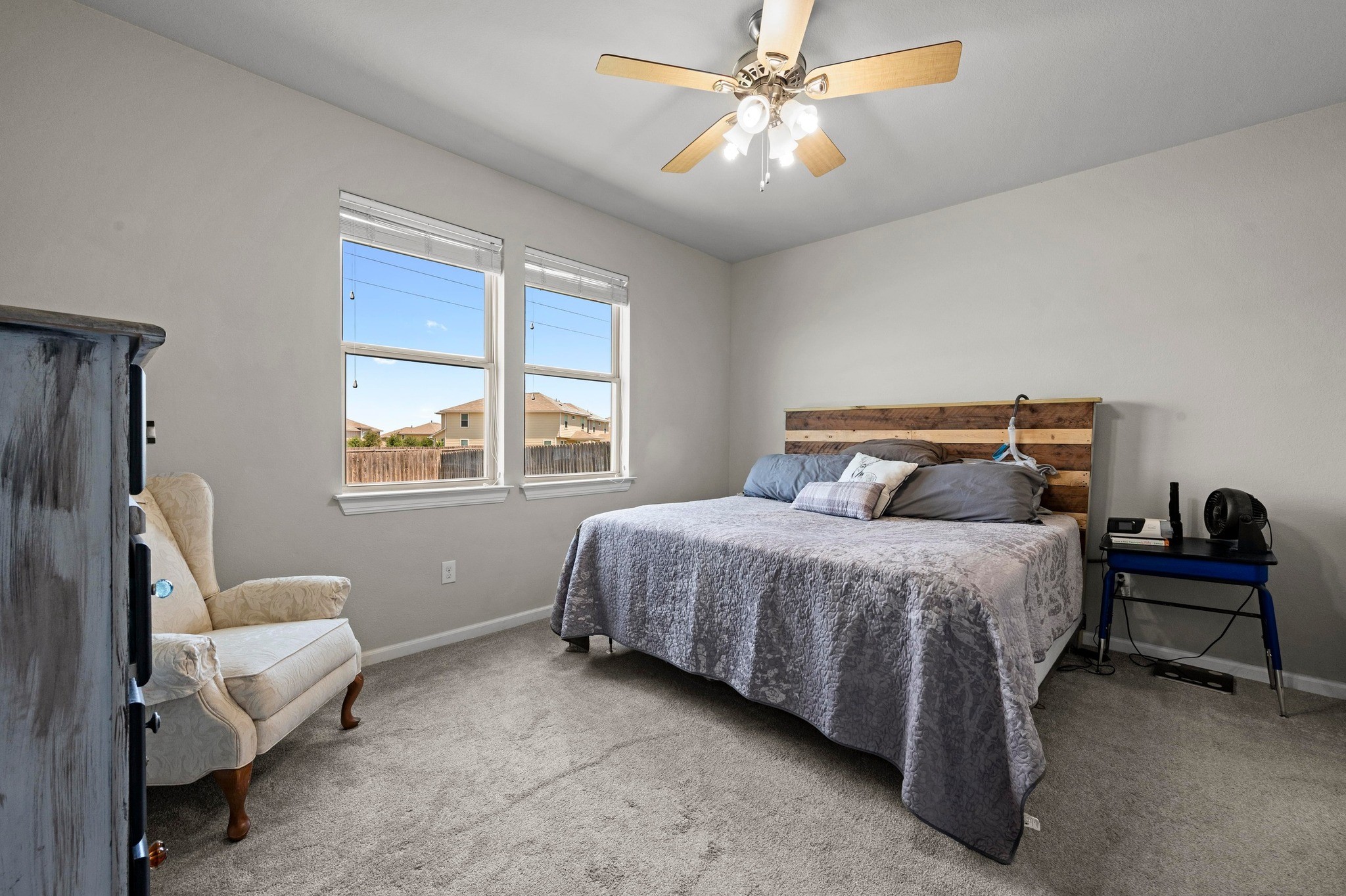 328 Triumph Road Buda, TX 78610 - Photo 11 of 18 Bedroom with baseboards, carpet flooring, and ceiling fan