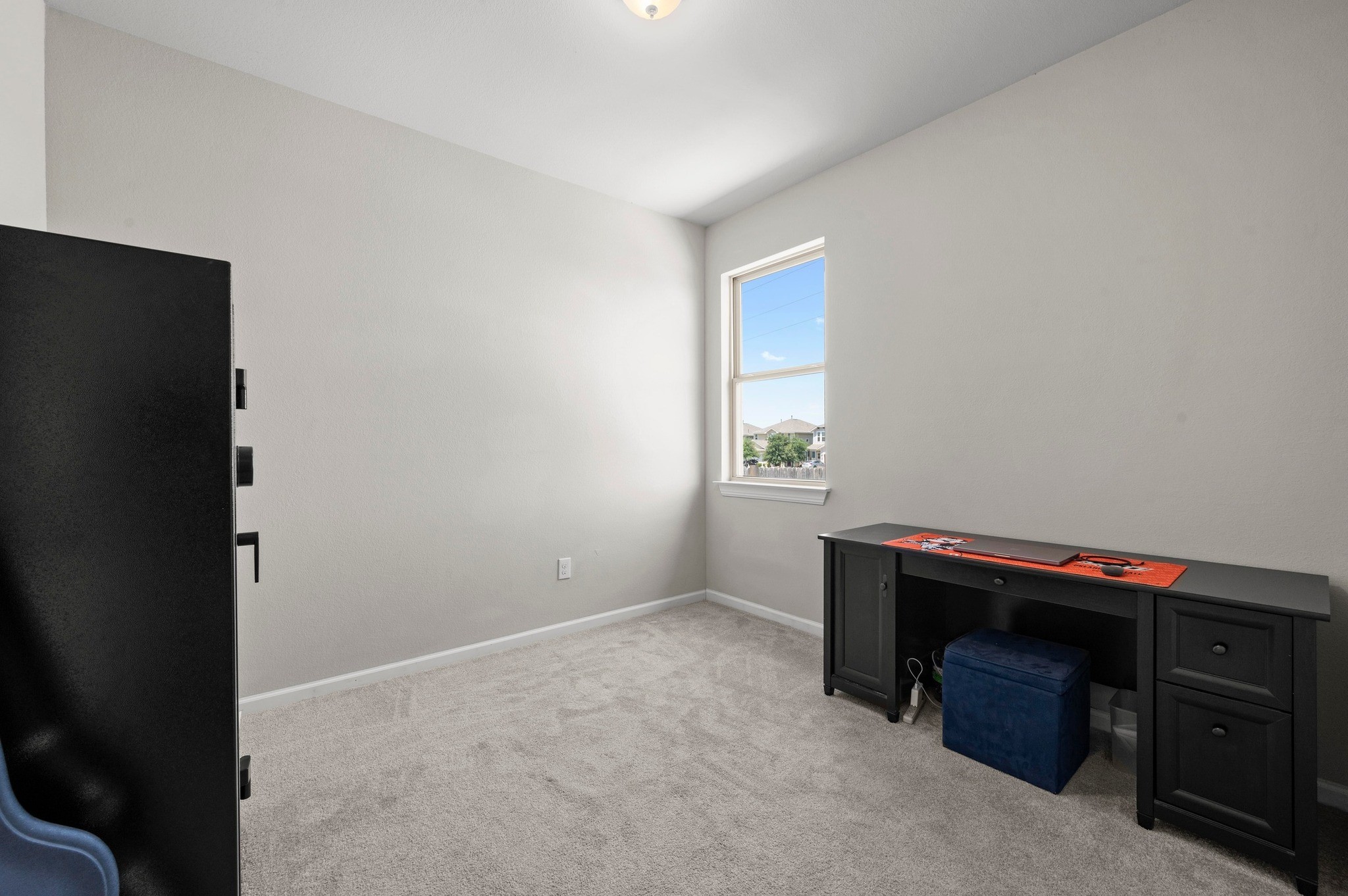 328 Triumph Road Buda, TX 78610 - Photo 13 of 18 Unfurnished office featuring light colored carpet and baseboards