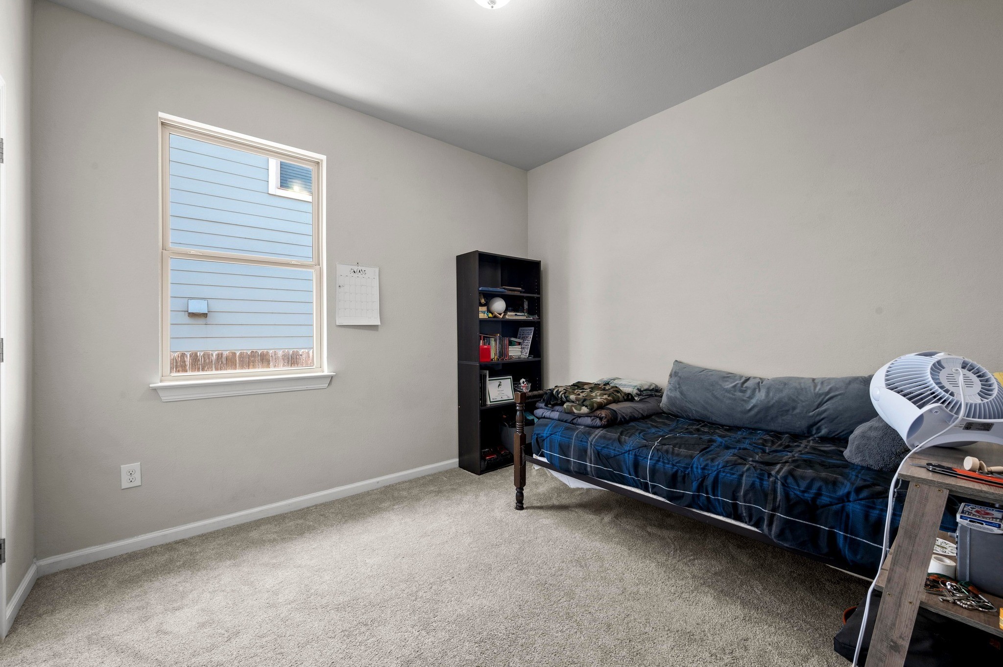 328 Triumph Road Buda, TX 78610 - Photo 15 of 18 Bedroom featuring carpet flooring and baseboards