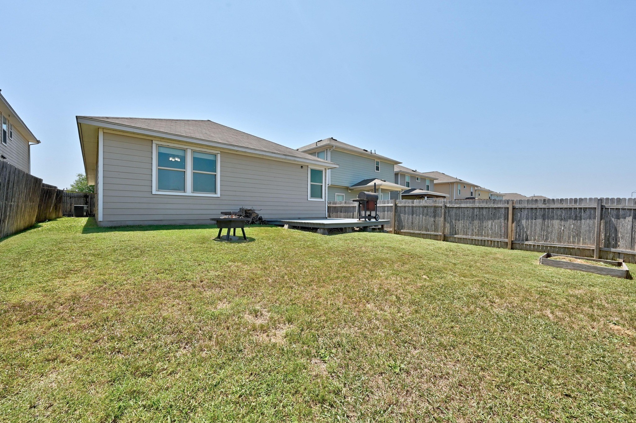 328 Triumph Road Buda, TX 78610 - Photo 18 of 18 Rear view of house with a wooden deck